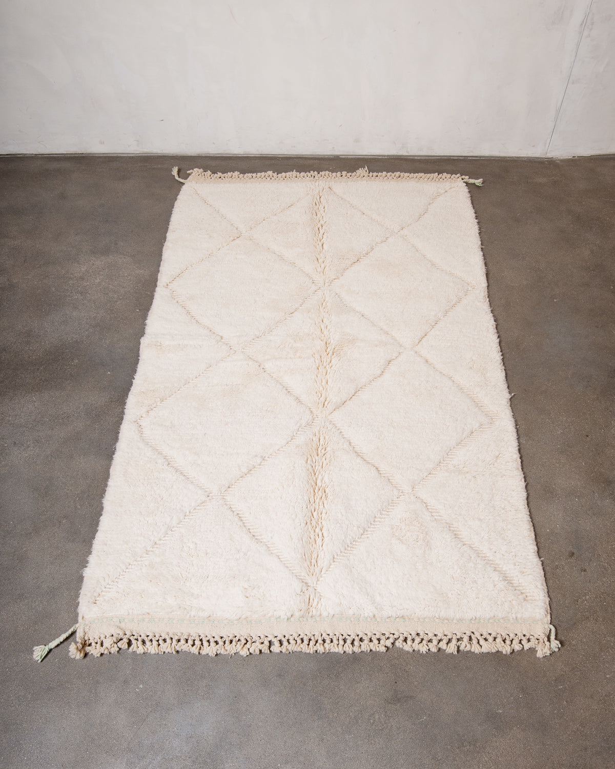 Modern, designer, handcrafted Berber rug from Morocco. Beniourain carpet with minimalist design, natural wool pile and a fluffy texture.